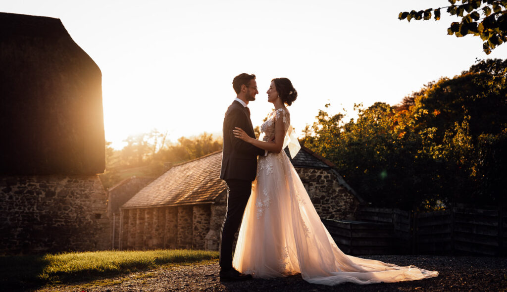 Bride and groom standing looking at each other during sunset at the great barn in devon
Paul aston Photography
Somerset wedding photographer
