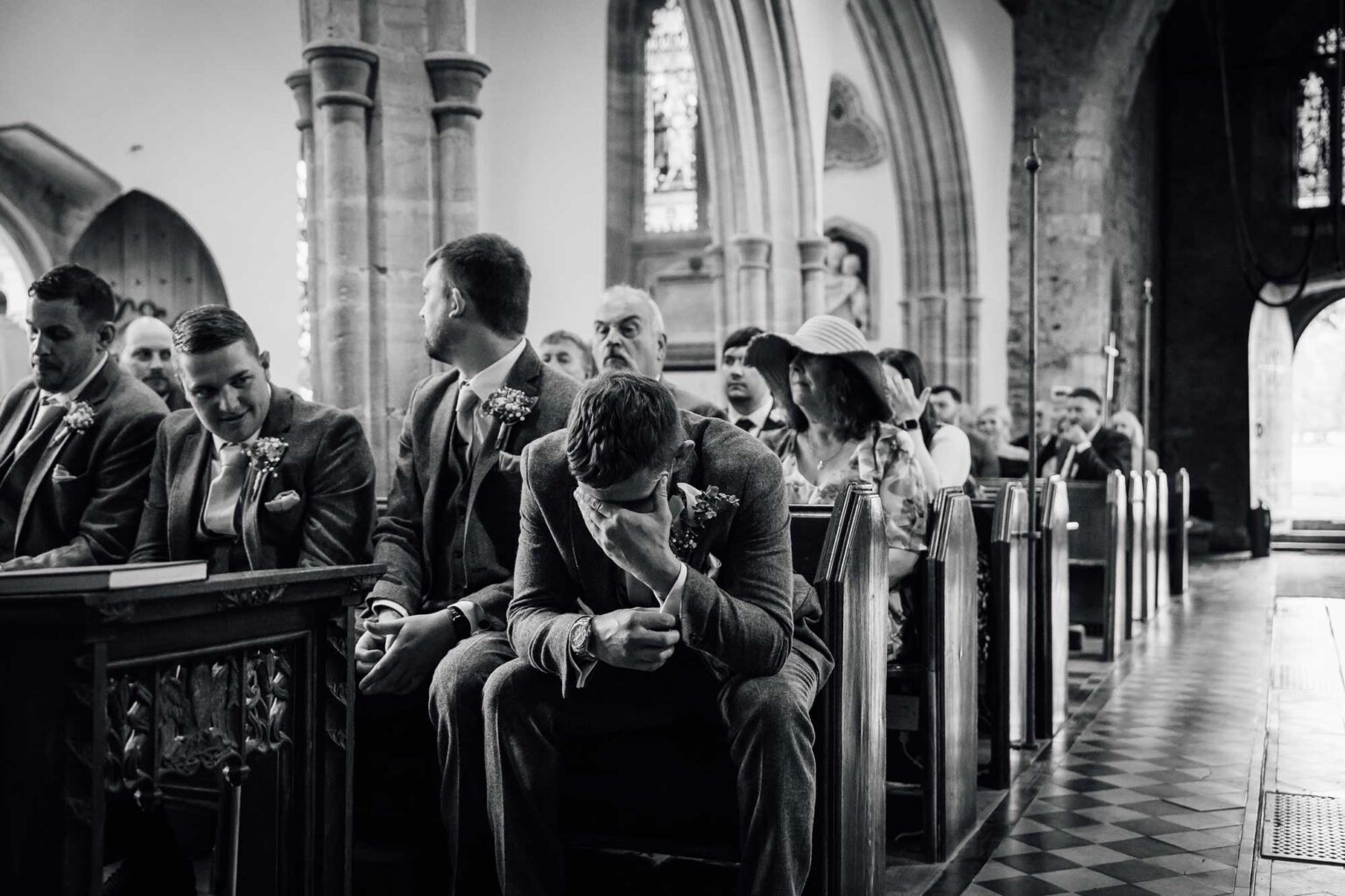 Nerves getting to the Groom as he awaits his brides arrival in church