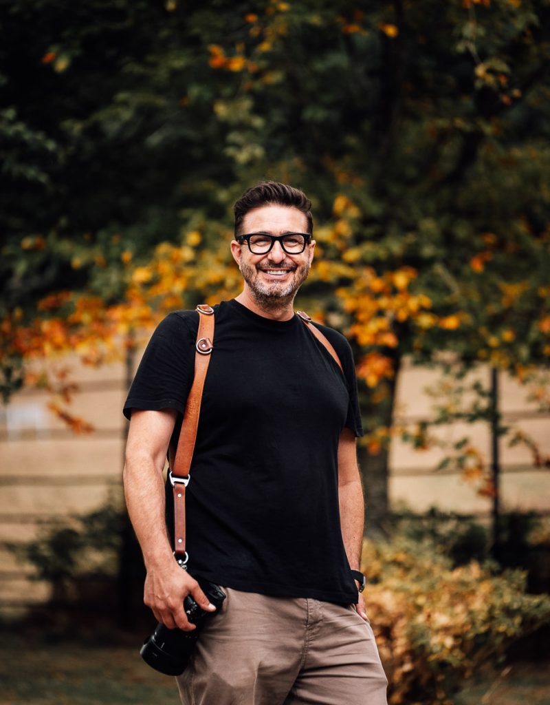 Paul Aston Photography standing in front of Crowcombe Court trees